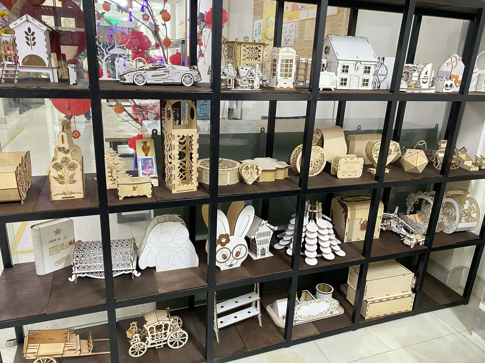Shelf of laser-cut decor wood and gift items