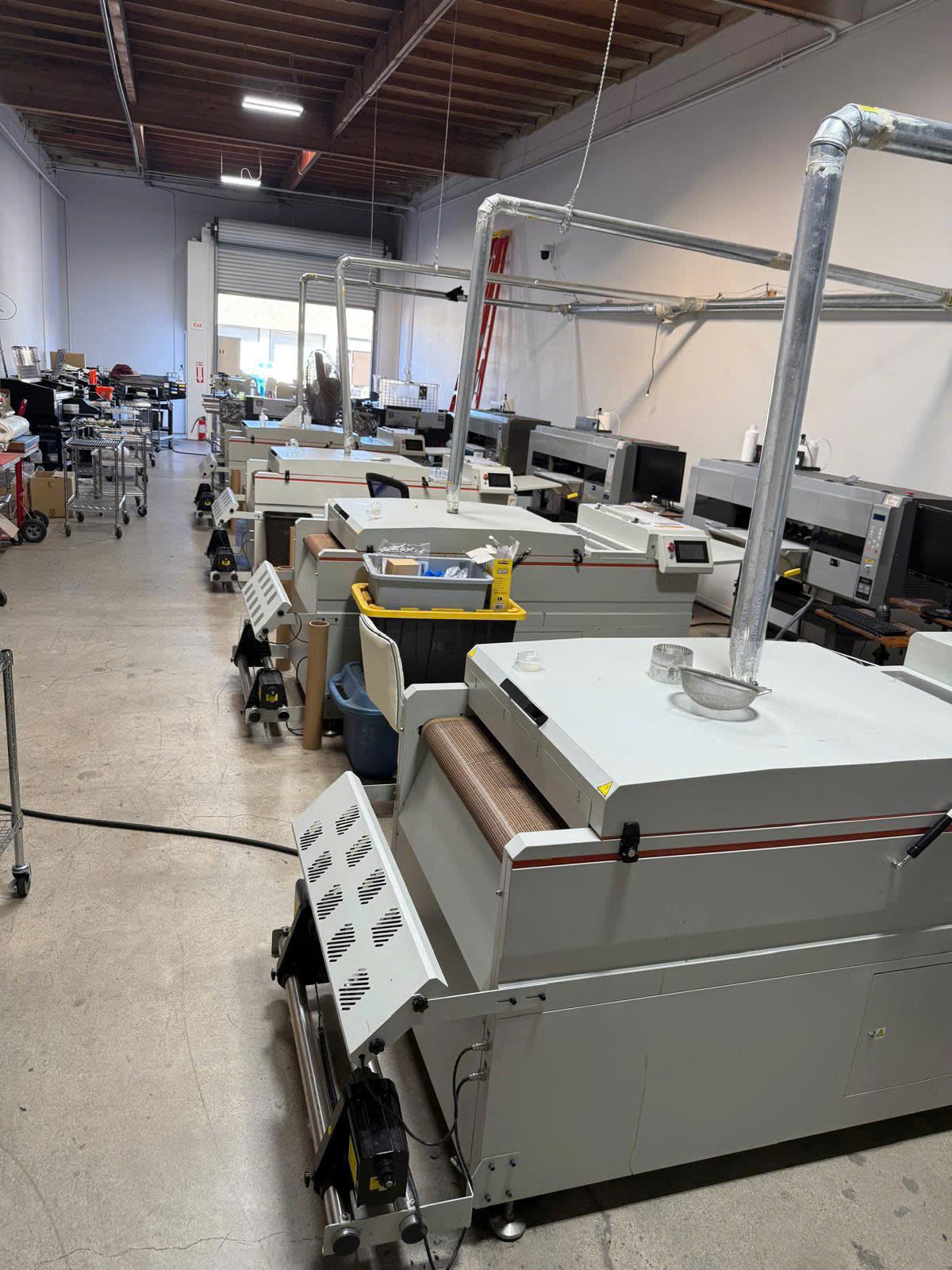 Row of industrial printing and press machines